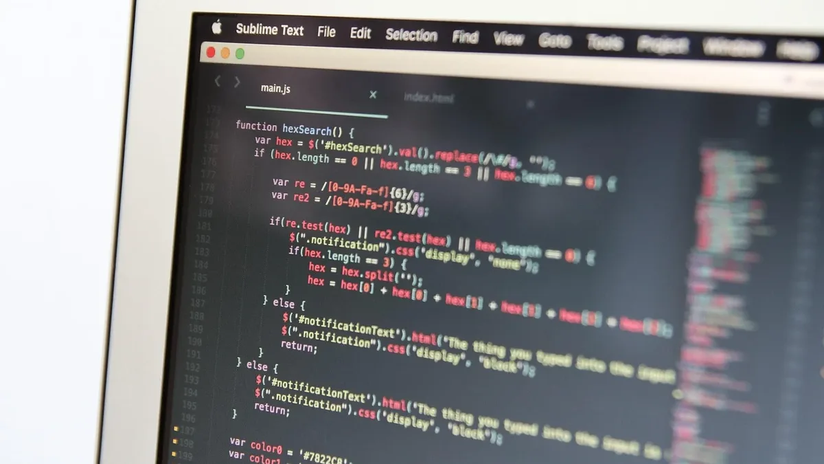A computer screen displaying a coding program, with the screen angled to the right and the top of the screen visible.